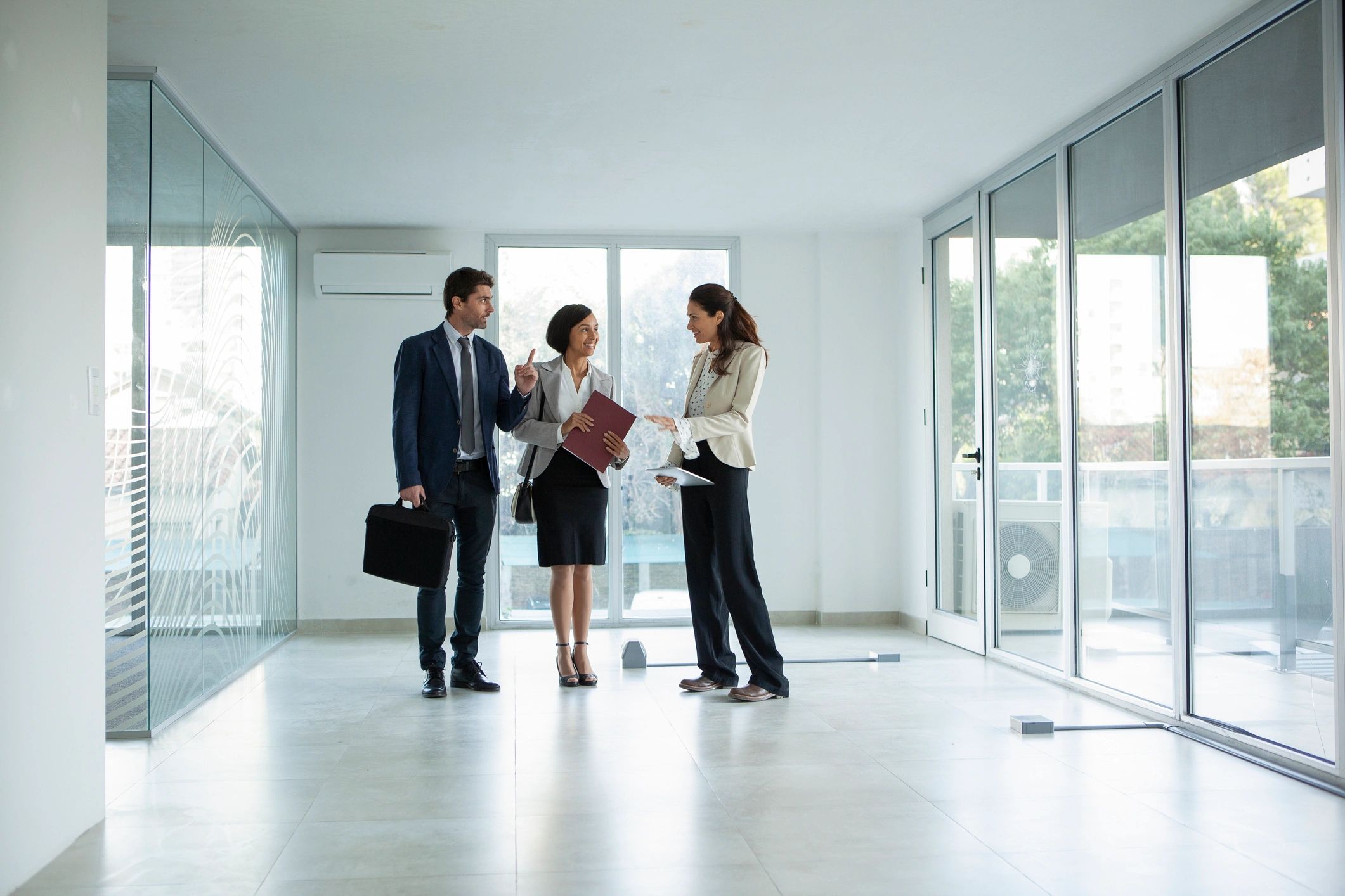 Real estate agent meeting with clients in an office