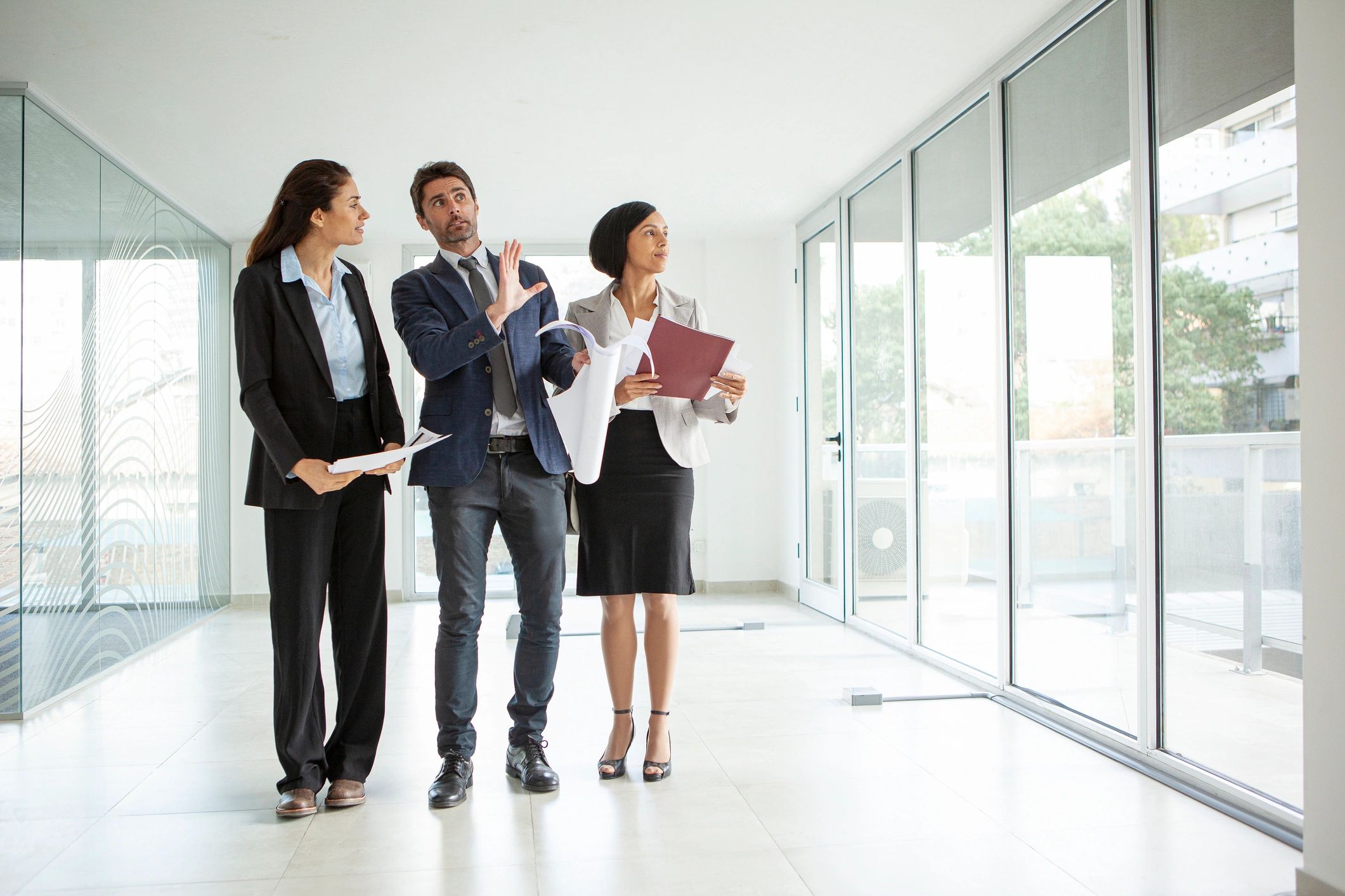 Professional advisor speaking with clients in an office