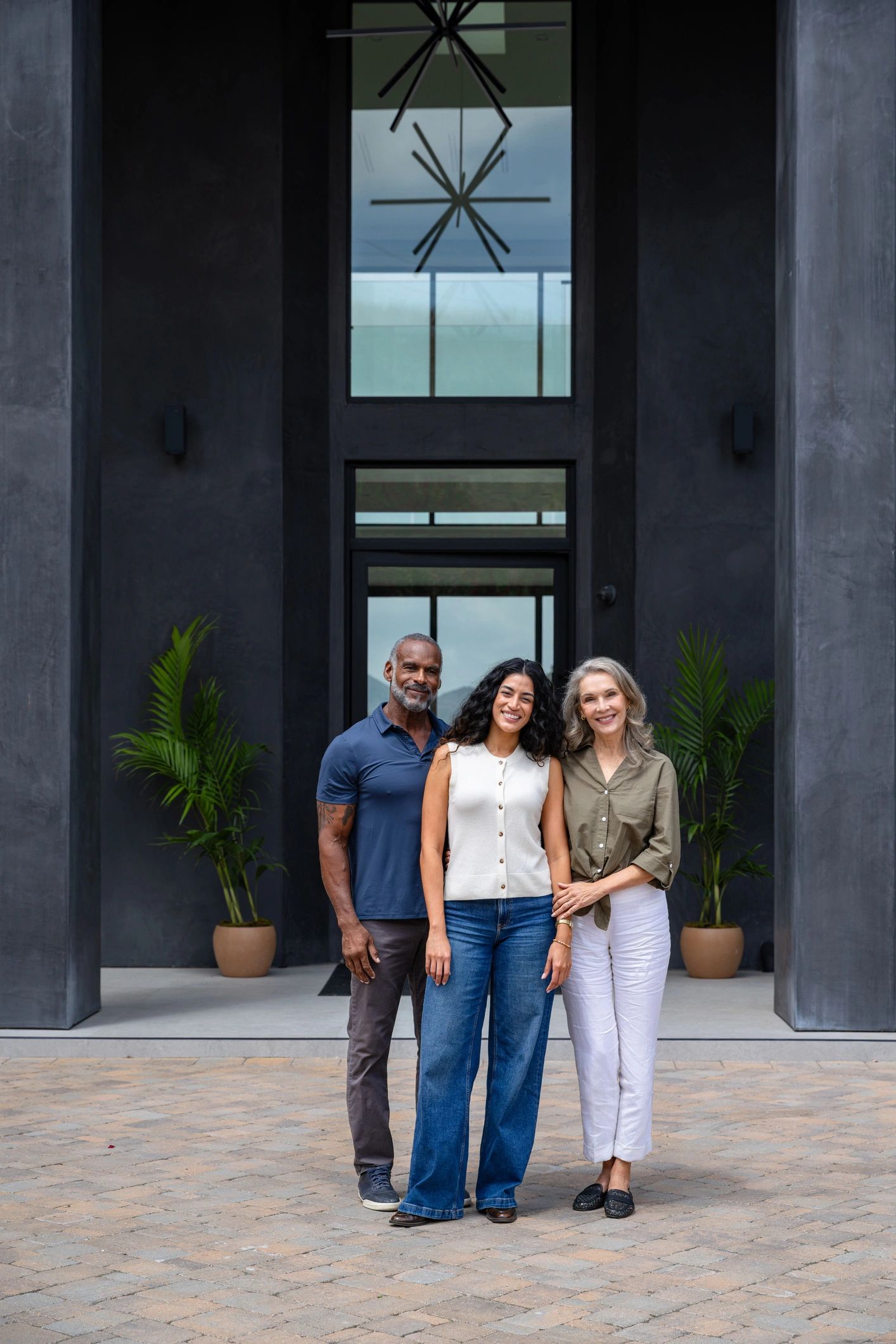 Client-facing team members outside a modern home